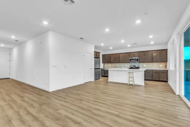 a view of kitchen with wooden floor