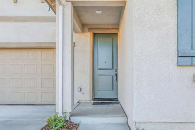a view of a hallway with wooden door