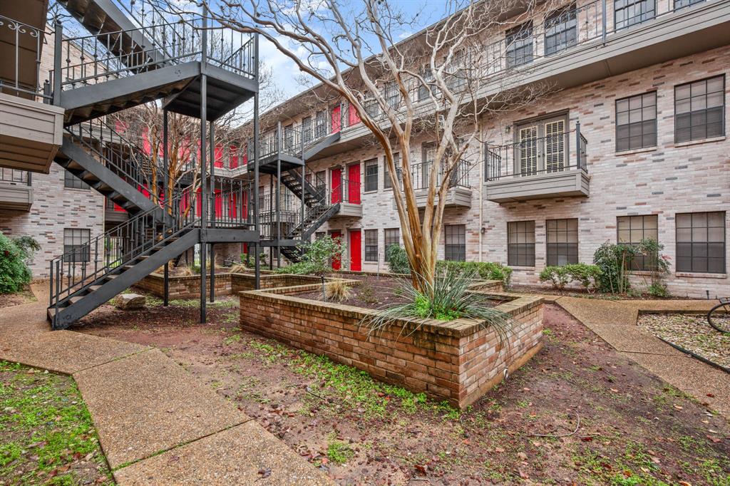 2216 San Gabriel Street, Unit 201 Austin, TX 78705 - Photo 10 of 11 a view of a house with a yard and potted plants
