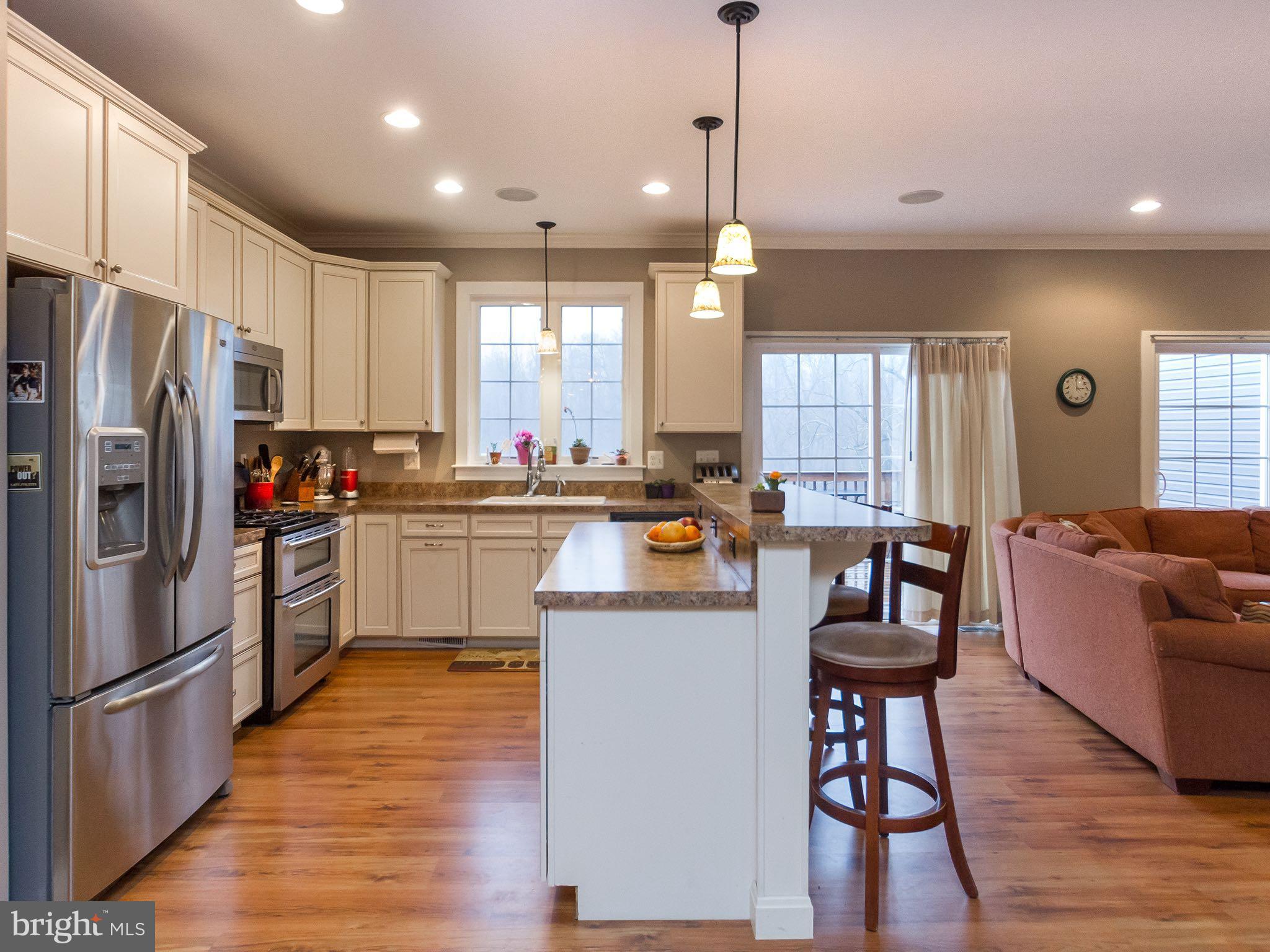 535 Monkton Road Monkton, MD 21111 - Photo 29 of 30 a kitchen with white cabinets and stainless steel appliances