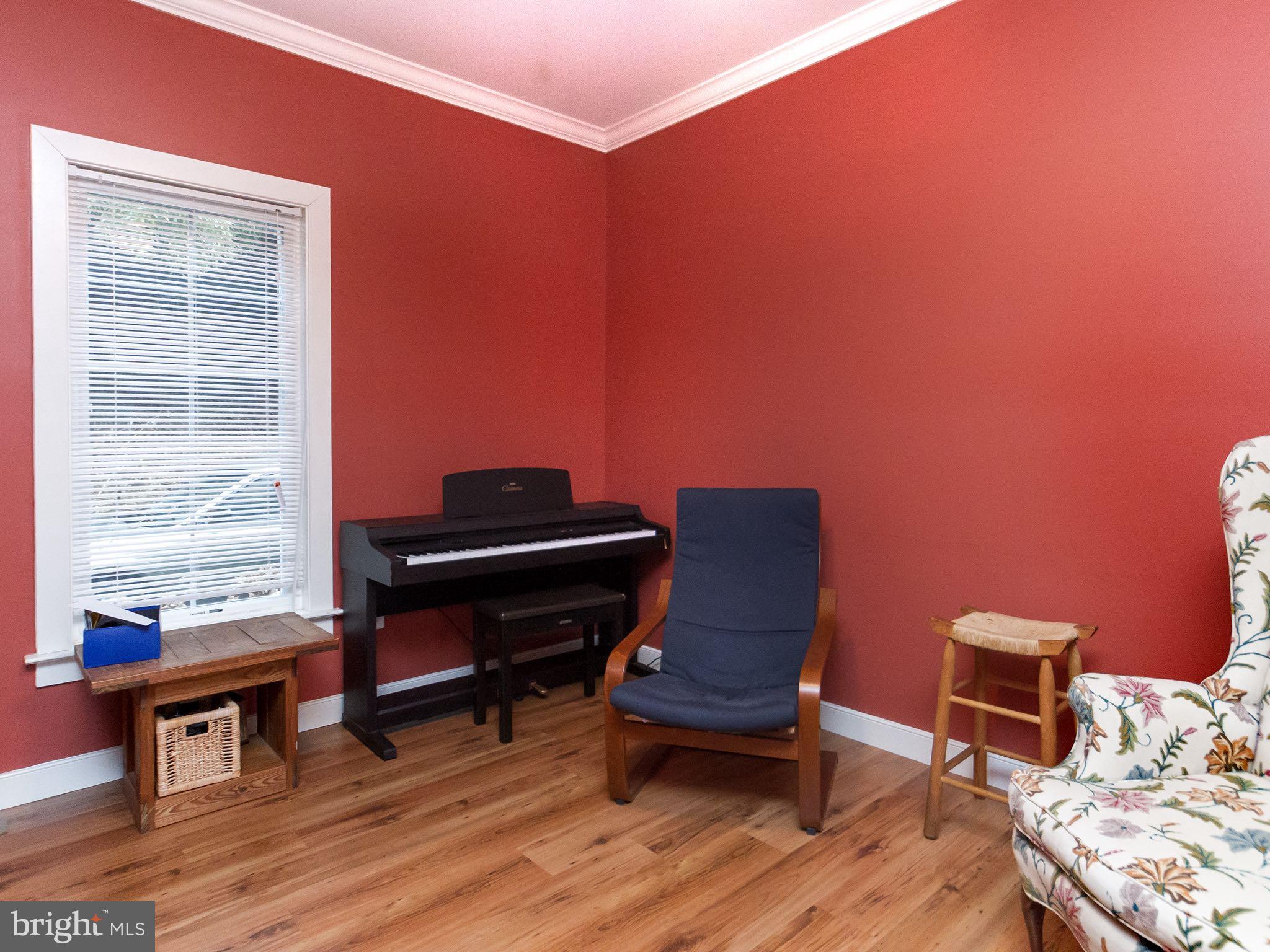 535 Monkton Road Monkton, MD 21111 - Photo 13 of 30 a living room with furniture a piano and wooden floor