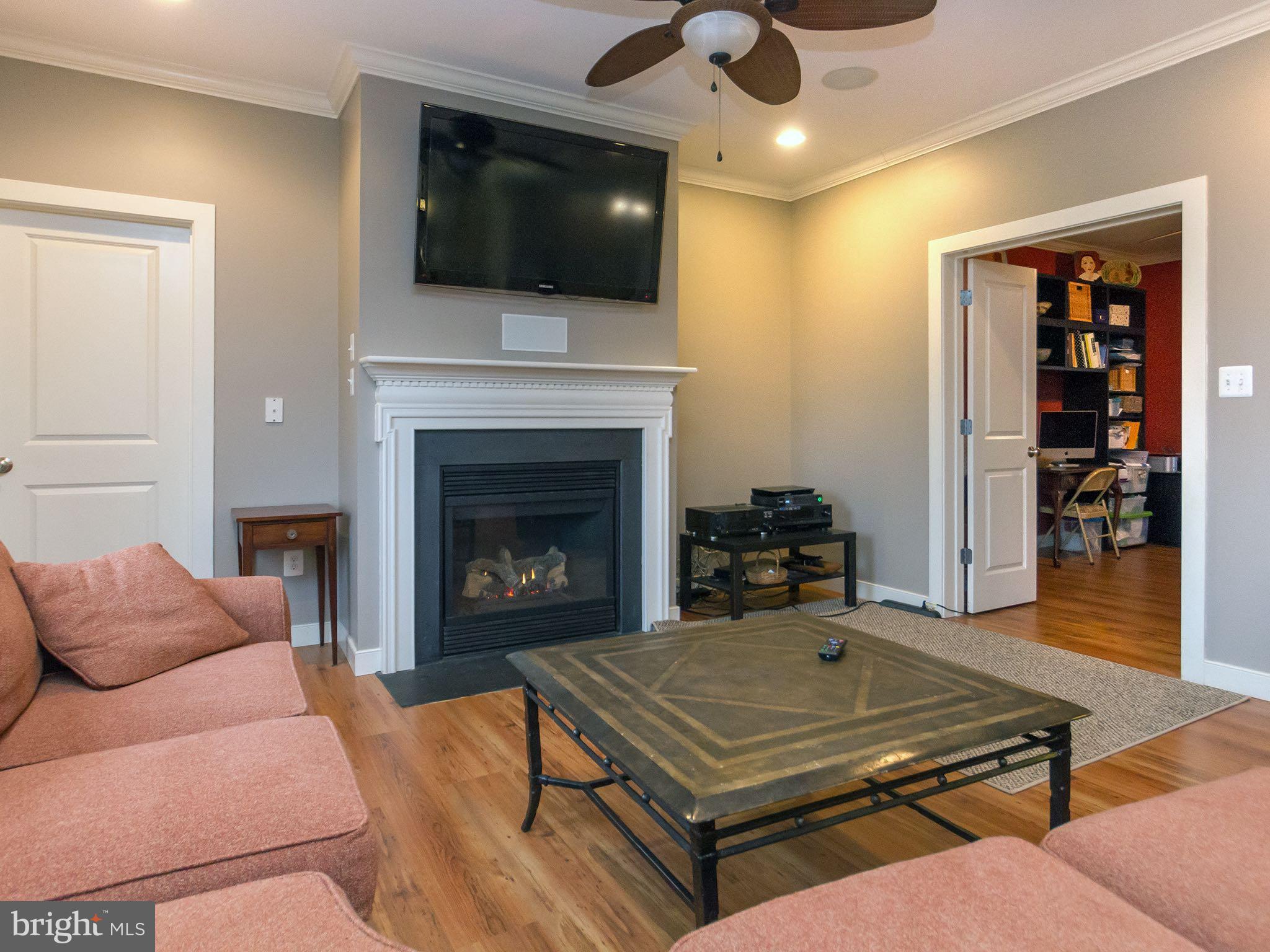 535 Monkton Road Monkton, MD 21111 - Photo 2 of 30 a living room with furniture a flat screen tv and a fireplace