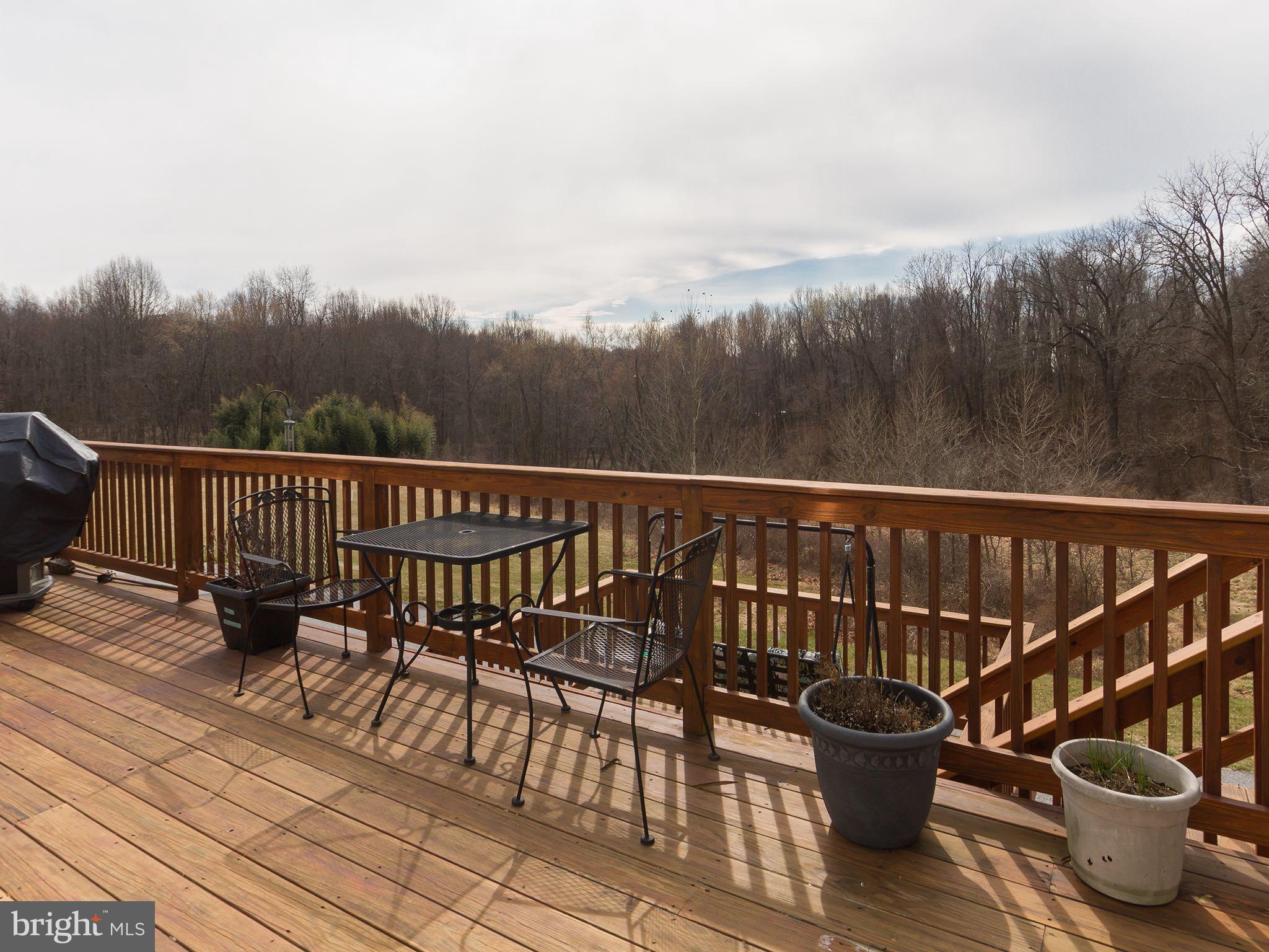 535 Monkton Road Monkton, MD 21111 - Photo 6 of 30 a view of balcony with two chairs and wooden floor