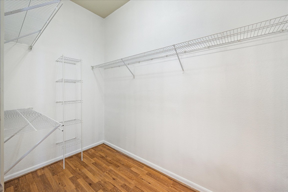 3505 Sage Road, Unit 2710 Houston, TX 77056 - Photo 17 of 23 a view of a room with racks on the wall
