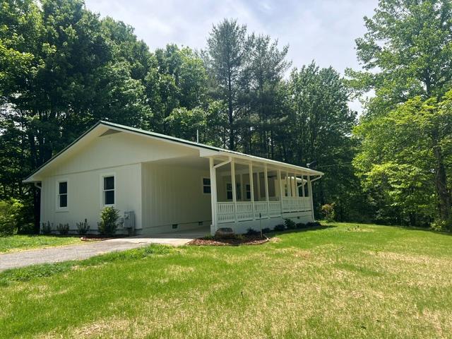 1616 Abe Cove Road Hiawassee, GA 30546 - Photo 4 of 17 a view of a house with yard and garden