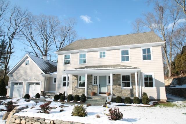 1 Red Coat Road Westport, CT 06880 - Photo 1 of 1 a front view of a house with a patio