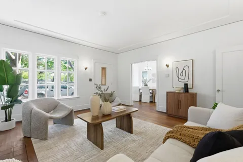 a living room with furniture and windows