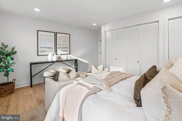 a bedroom with a bed and couch