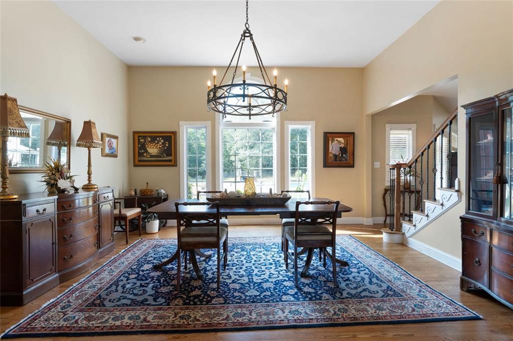 1211 Bellview Road Rockmart, GA 30153 - Photo 11 of 42 a living room filled with furniture and a chandelier