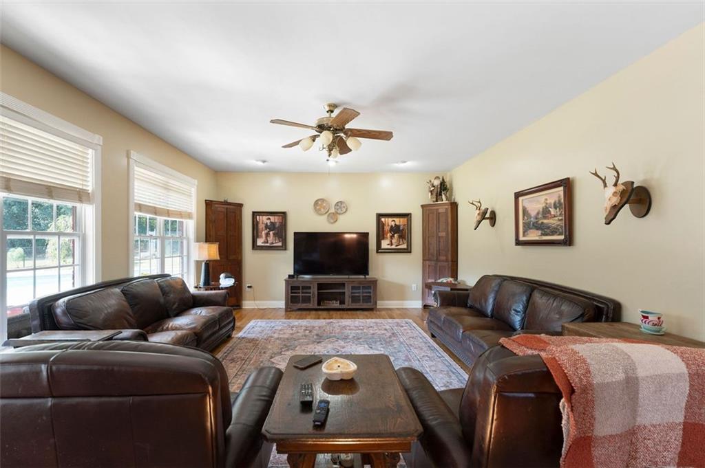 1211 Bellview Road Rockmart, GA 30153 - Photo 17 of 42 a bedroom with a bed and a flat screen tv