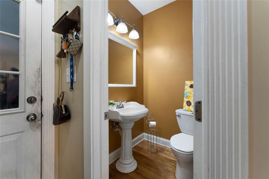 1211 Bellview Road Rockmart, GA 30153 - Photo 19 of 42 a bathroom with a toilet and a mirror