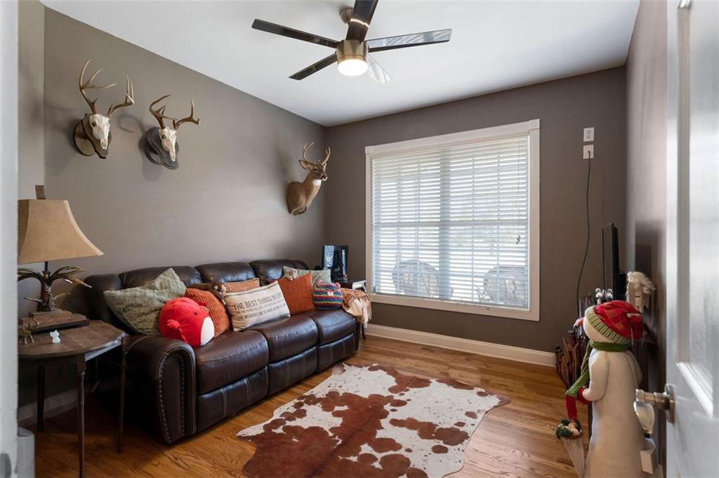 1211 Bellview Road Rockmart, GA 30153 - Photo 20 of 42 a living room with furniture rug and window