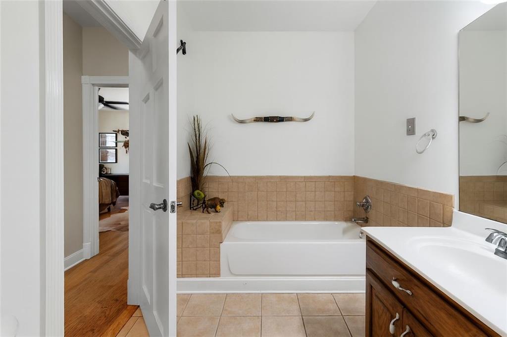 1211 Bellview Road Rockmart, GA 30153 - Photo 22 of 42 a bathroom with a bathtub and a sink