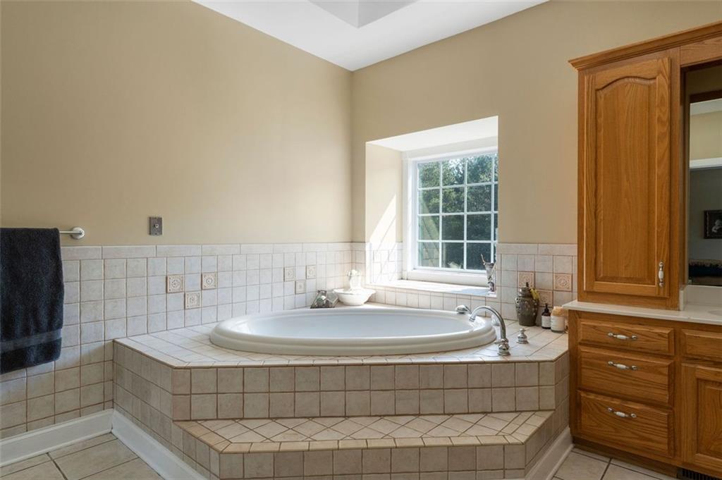 1211 Bellview Road Rockmart, GA 30153 - Photo 26 of 42 a bathroom with a tub a sink and a shower