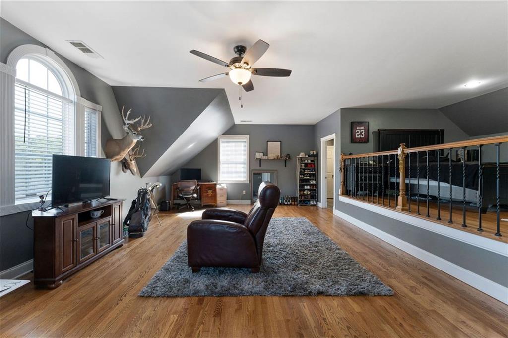 1211 Bellview Road Rockmart, GA 30153 - Photo 27 of 42 a living room with furniture and a flat screen tv