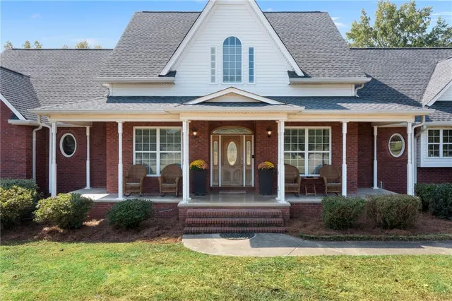 a front view of a house with garden