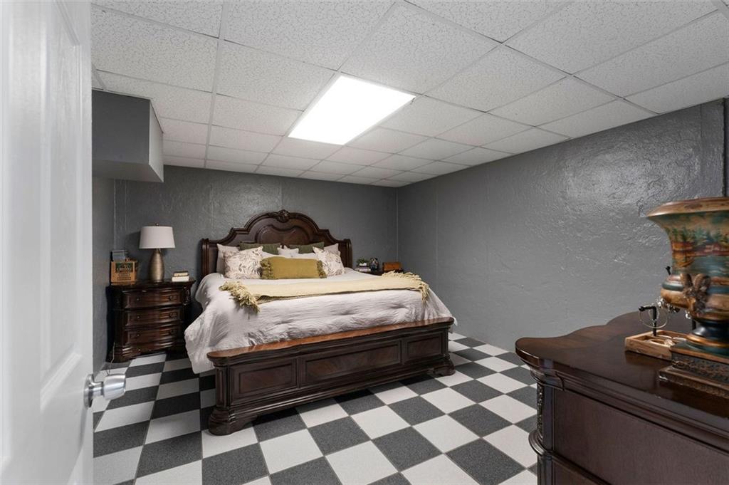 1211 Bellview Road Rockmart, GA 30153 - Photo 32 of 42 a bedroom with a bed and wooden floor