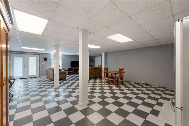 a view of a hall with a dining table and chair