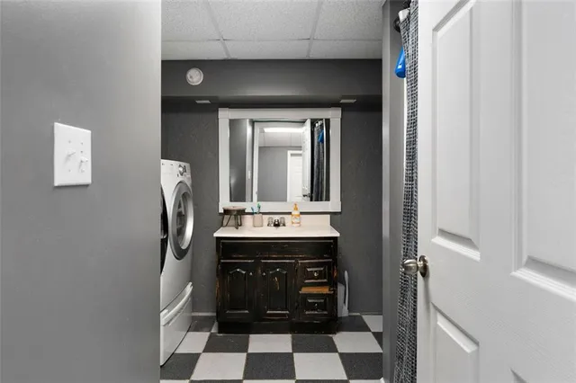 a room with a walk in closet and wooden floor