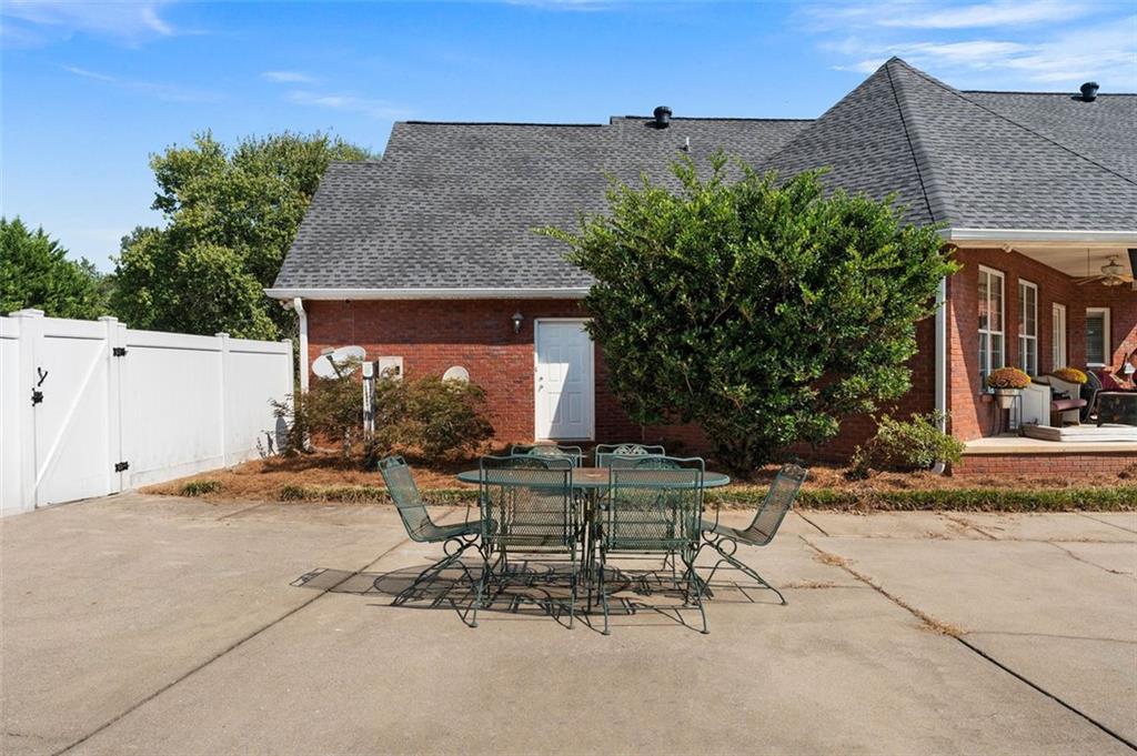 1211 Bellview Road Rockmart, GA 30153 - Photo 38 of 42 a view of a patio with table and chairs and potted plants