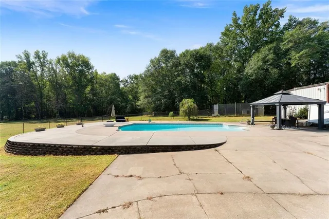 a view of a swimming pool with a patio