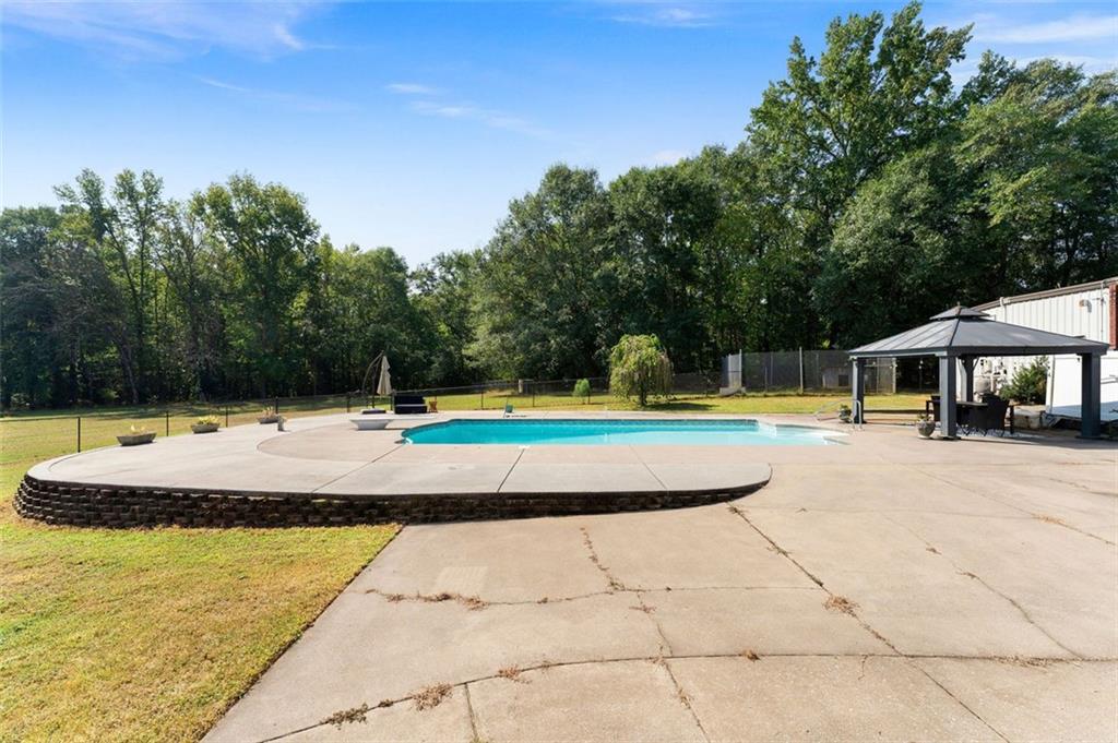 1211 Bellview Road Rockmart, GA 30153 - Photo 39 of 42 a view of a swimming pool with a patio