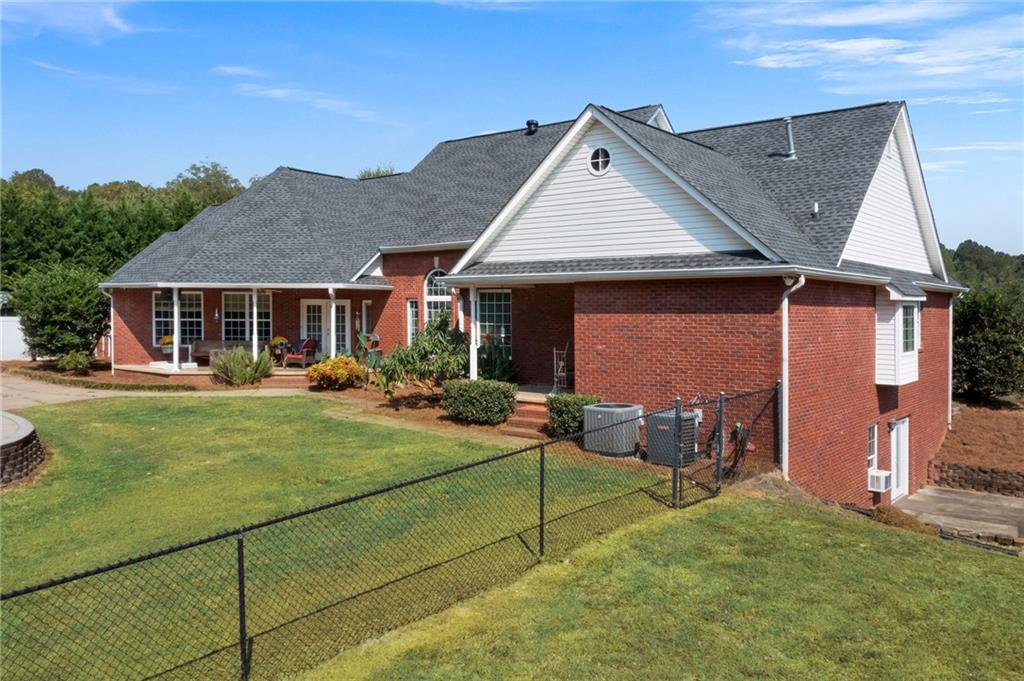 1211 Bellview Road Rockmart, GA 30153 - Photo 42 of 42 a backyard of a house with yard table and chairs