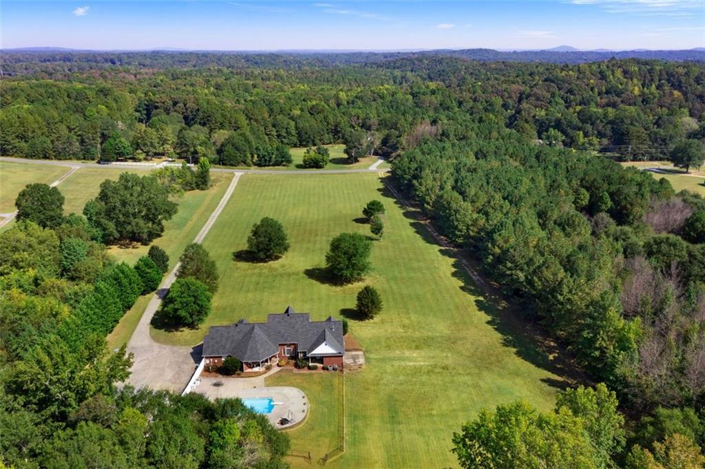 1211 Bellview Road Rockmart, GA 30153 - Photo 6 of 42 a view of a lake with a yard