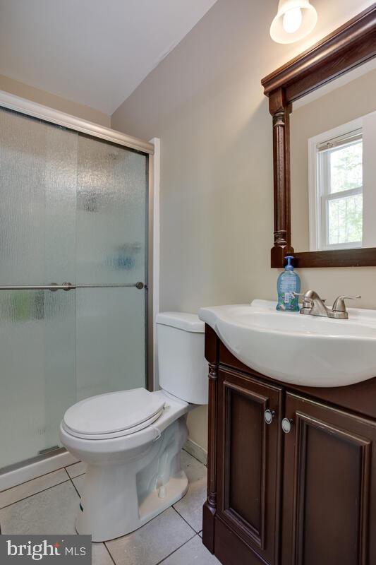 1420 Wilson Road Huntingtown, MD 20639 - Photo 31 of 43 a bathroom with a sink a toilet a mirror and shower