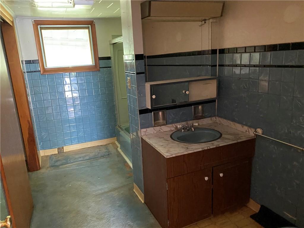 451 Great Belt Road Butler, PA 16002 - Photo 10 of 16 a bathroom with a sink a toilet and shower