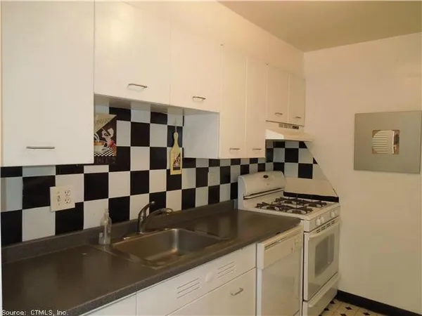 a view of a kitchen with a sink