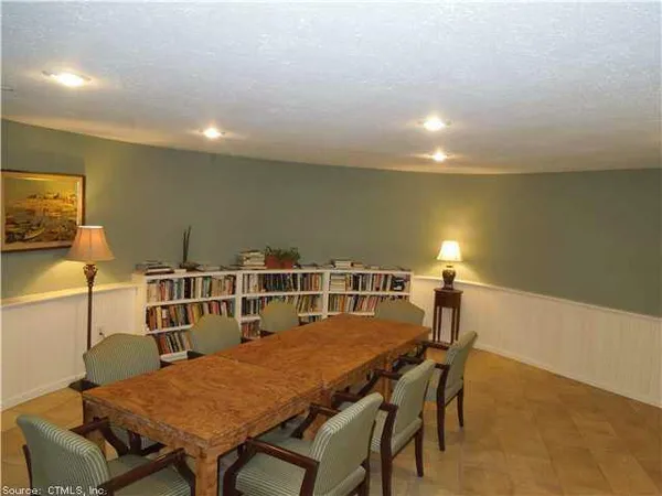 a dining room with a table and chairs