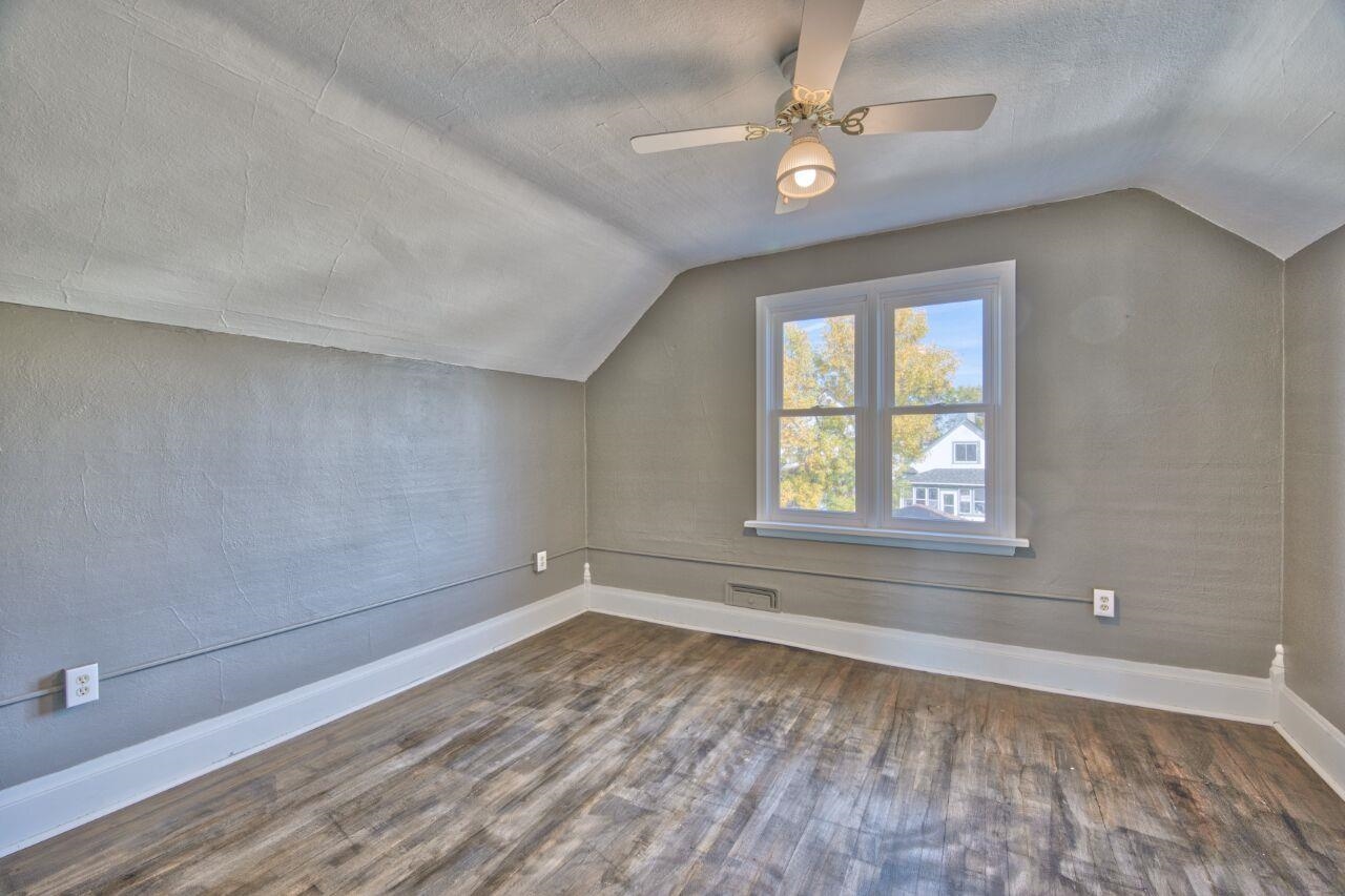 25 3rd Street Southwest Chisholm, MN 55719 - Photo 15 of 44 Bedroom with lofted ceiling, dark wood finished floors, a textured ceiling, and ceiling fan