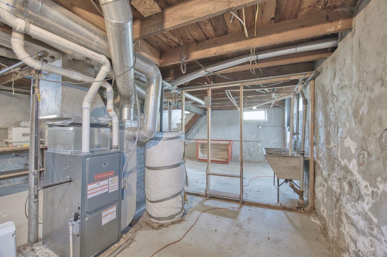 25 3rd Street Southwest Chisholm, MN 55719 - Photo 23 of 44 Below grade area with water heater and heating unit