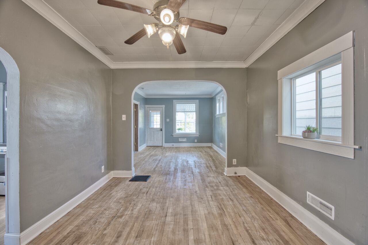 25 3rd Street Southwest Chisholm, MN 55719 - Photo 6 of 44 arched walkways, ornamental molding, light wood finished floors, and a ceiling fan