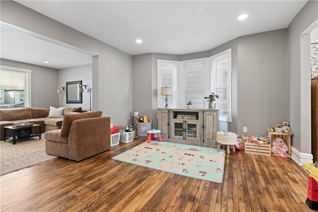 107 Sumner Avenue Vandergrift, PA 15690 - Photo 6 of 31 a living room with furniture and wooden floor