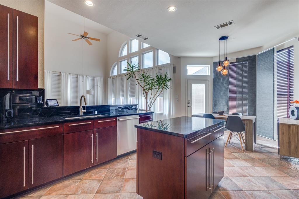 3313 Madison Avenue Hurst, TX 76054 - Photo 14 of 36 Kitchen with a kitchen island, includes stainless refrigerator.