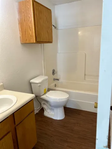 a bathroom with a toilet a sink and bathtub