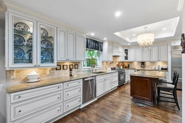 a kitchen with a sink cabinets and window
