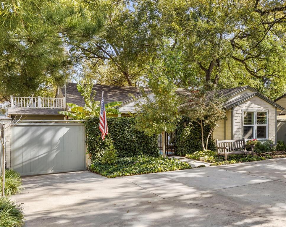 1432 Sylvan Avenue Dallas, TX 75208 - Photo 1 of 40 a front view of a house with a yard and garage