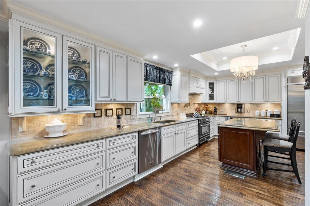 1432 Sylvan Avenue Dallas, TX 75208 - Photo 11 of 40 a kitchen with a sink cabinets and window