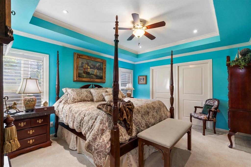 1432 Sylvan Avenue Dallas, TX 75208 - Photo 18 of 40 a bedroom with a bed chandelier and a window