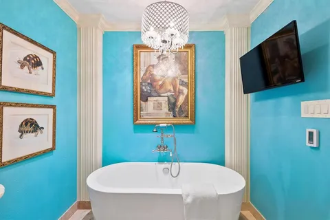 a bathroom with a double vanity sink toilet and shower