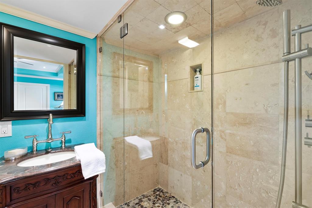 1432 Sylvan Avenue Dallas, TX 75208 - Photo 22 of 40 a bathroom with a double vanity sink toilet and shower