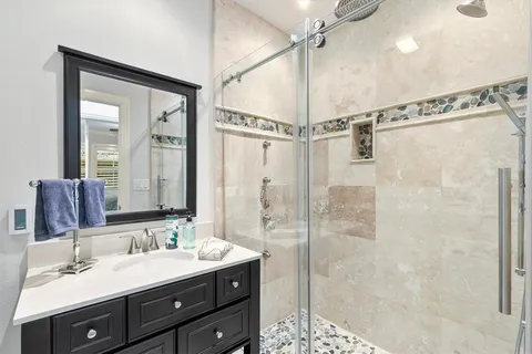 a view of a hallway with wooden floor and workspace