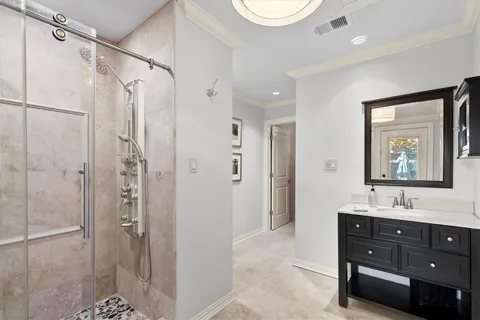 a bathroom with a shower and a sink
