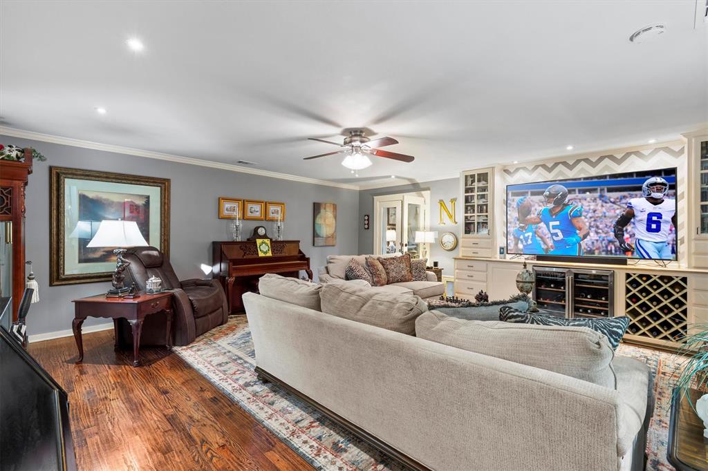 1432 Sylvan Avenue Dallas, TX 75208 - Photo 30 of 40 a living room with furniture ceiling fan and a rug