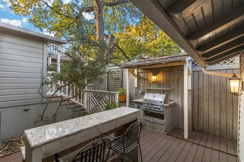 a view of a house with backyard and deck