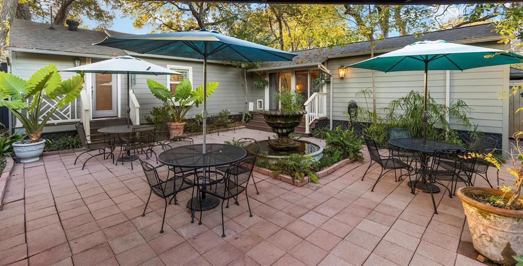 1432 Sylvan Avenue Dallas, TX 75208 - Photo 38 of 40 an outdoor space with furniture and umbrella