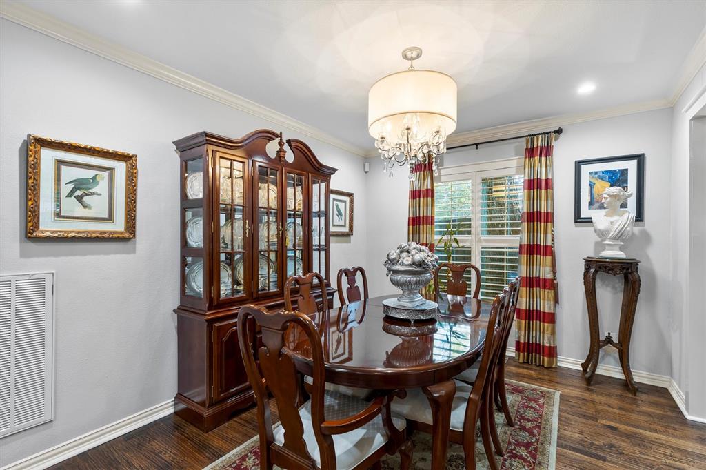 1432 Sylvan Avenue Dallas, TX 75208 - Photo 10 of 40 a view of a dining room with furniture window and wooden floor